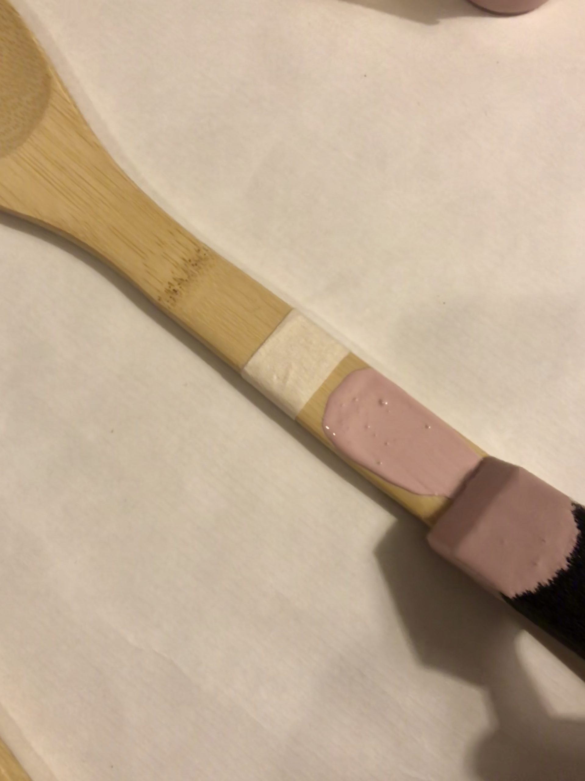 A close up view of one utensil showing someone starting to paint.