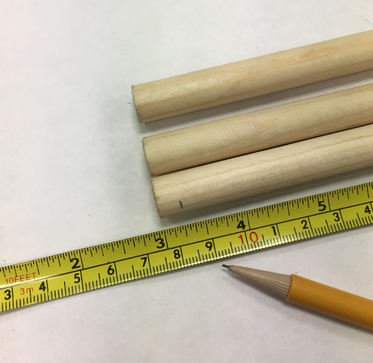 Three long wood dowels and a measuring tape. Showing a pencil mark for where to cut the wood.