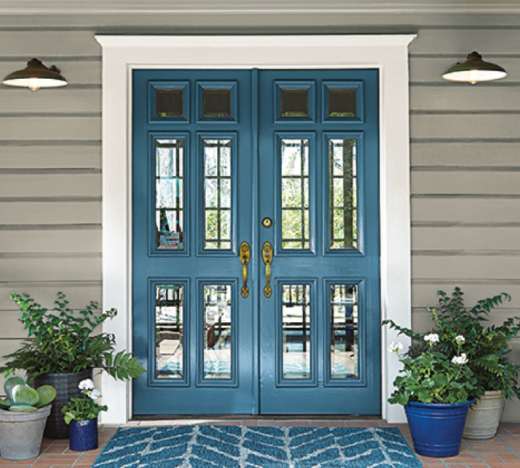 An exterior home front entry with the door painted in Blueprint.