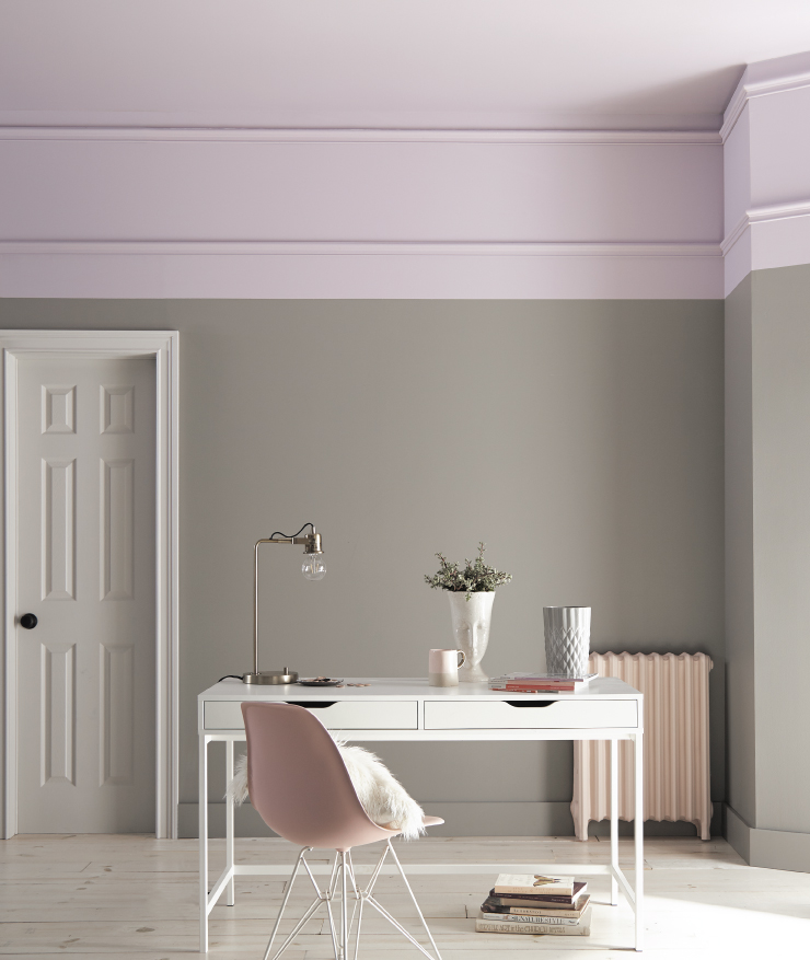 A home office showing gray with a large purple trim at the top between wall and ceiling.