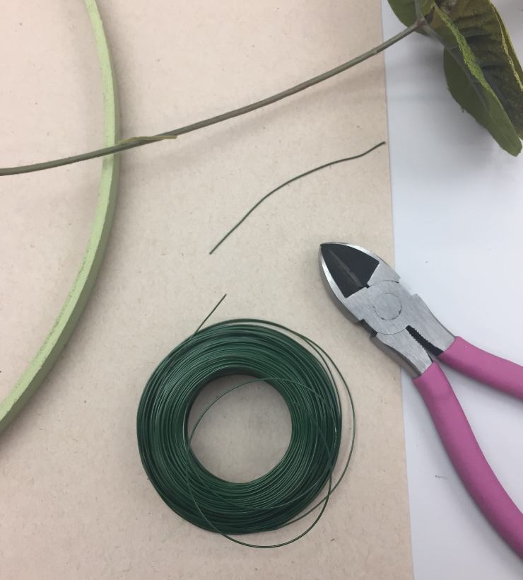 Tools needed for adhering the plastic leaves to the hoop; green thin wire, wire cuter, plastic leaves, hoop.