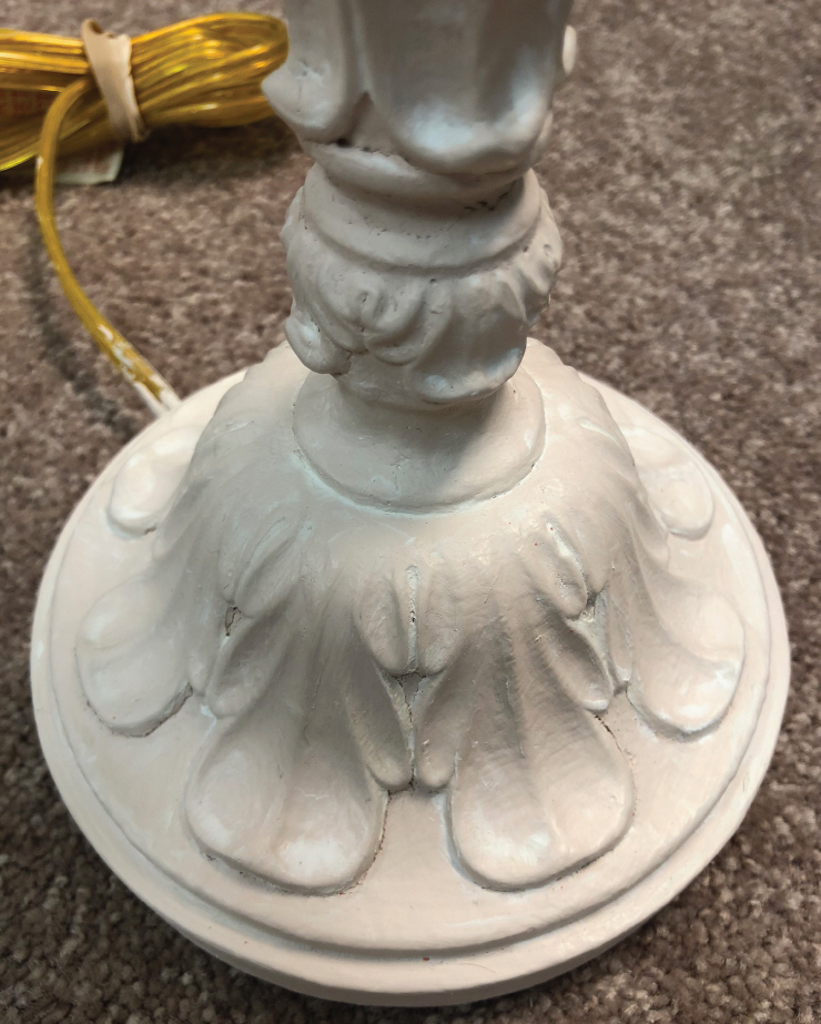 A after image of a lamp's base after it has been painted and waxed.
