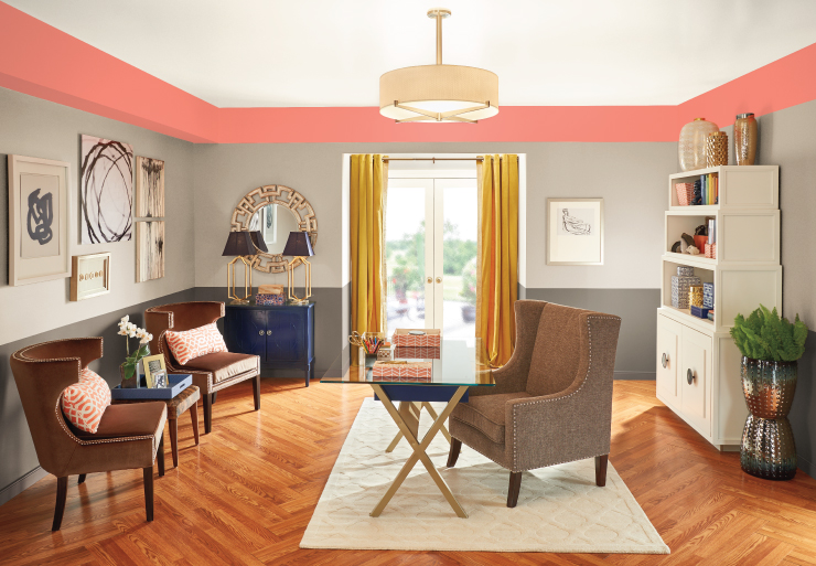 A living Room with the top boarder of the walls painted in Guava Jelly.