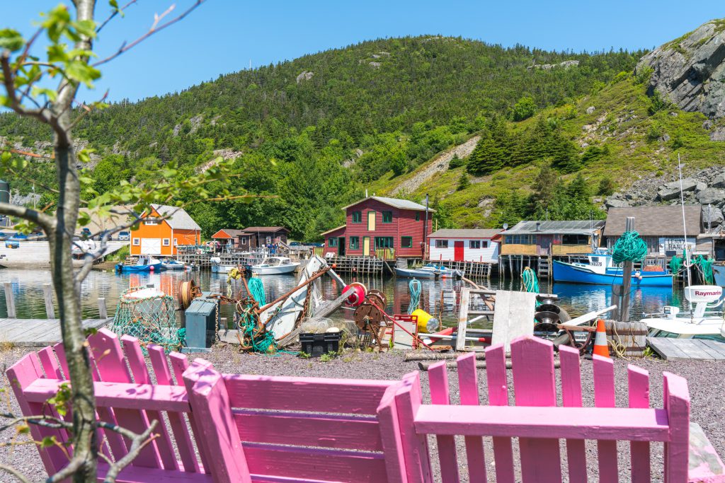 A view of trash art for St. John’s showing oars and rope. Two pink chairs are in the foreground of the image.
