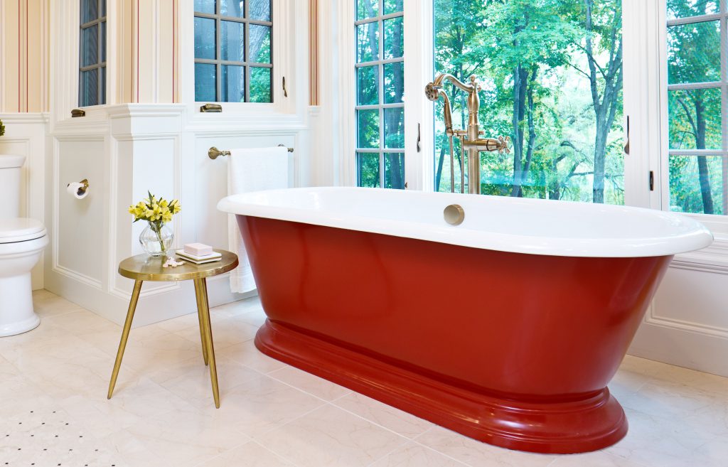  A a grand bathroom featuring beautiful standalone tub painted in a rich red color similar to Red Pepper. 