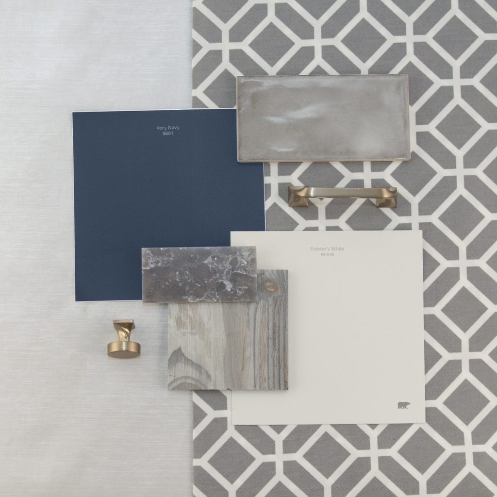 This is an inspirational photo on how to furnish your kitchen. There are two peel n stick swatches in Very Navy and Painter's White. These are paired with a gray wood swatch for flooring, dark gray sparkle granite swatch, and a light gray tile backsplash, there is also a knob for cabinets and a handle for cabinets, each are in a chrome tone. 
Behind the materials is fabric laid out in a very light gray tone and other fabric is a hexagonal pattern. 