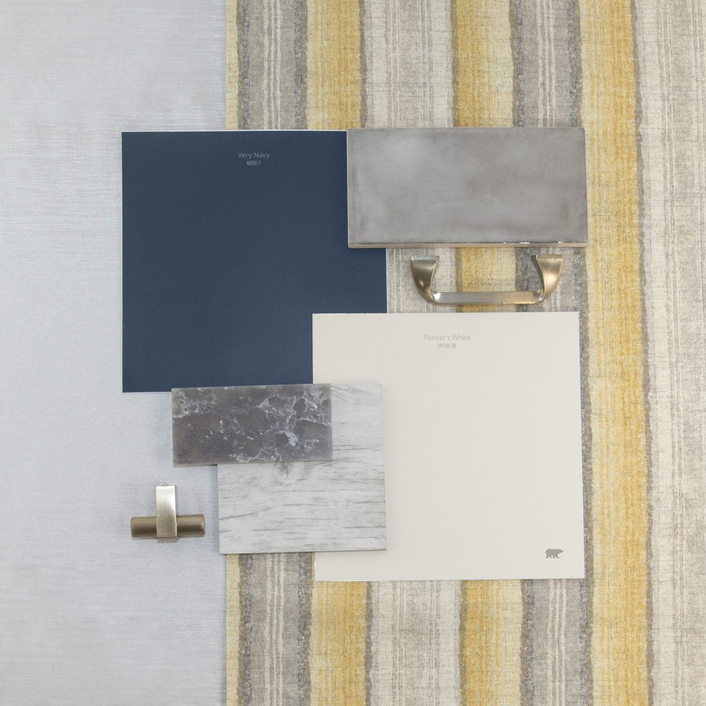 This is an inspirational photo on how to furnish your kitchen. There are two peel n stick swatches in Very Navy and Painter's White. These are paired with a light white-gray wood swatch for flooring, dark gray sparkle granite swatch, and a light gray tile backsplash, there is also a knob for cabinets and a handle for cabinets, each are in a chrome tone. 
Behind the materials is fabric laid out in a very light gray tone and other fabric has vertical stripes in gray, cream and yellow. 