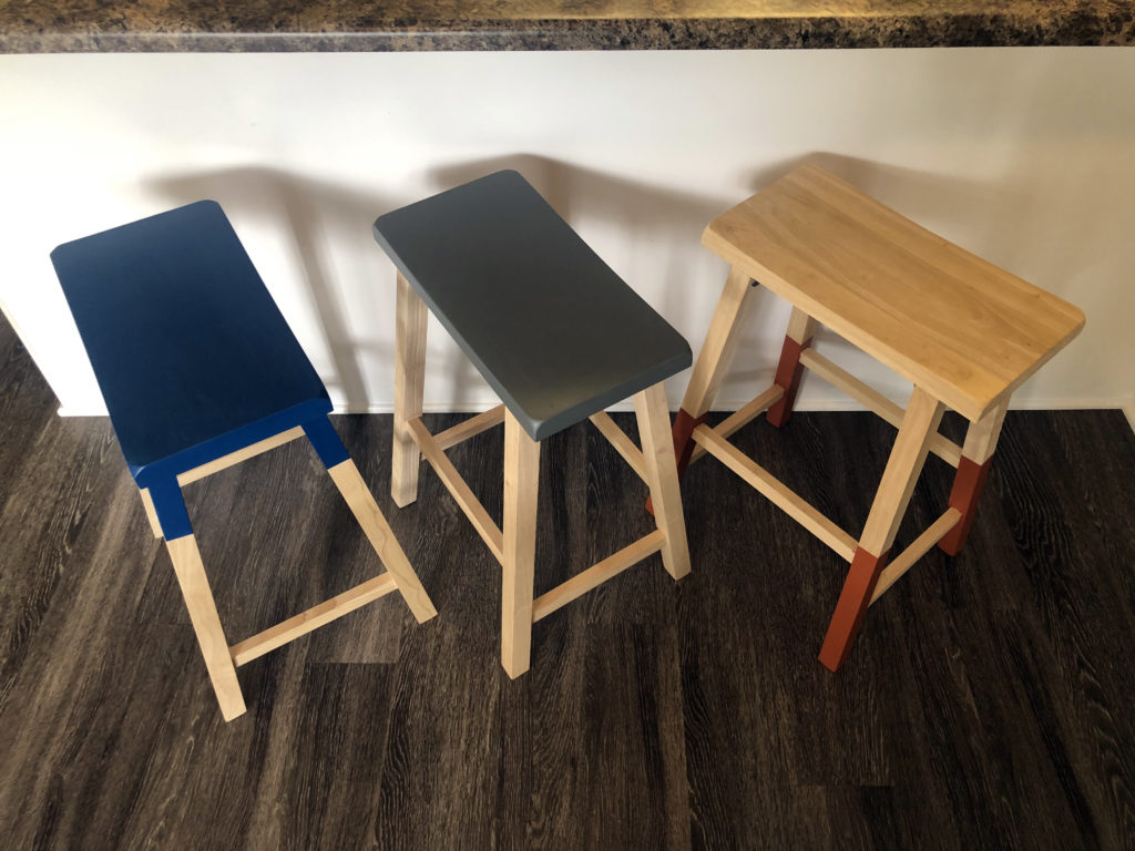 This image is the finished look of all three stools beneath a kitchen bar. 