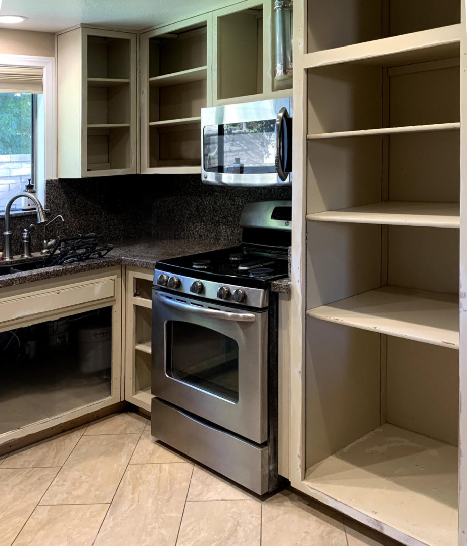 image showing kitchen with the cabinets removed.