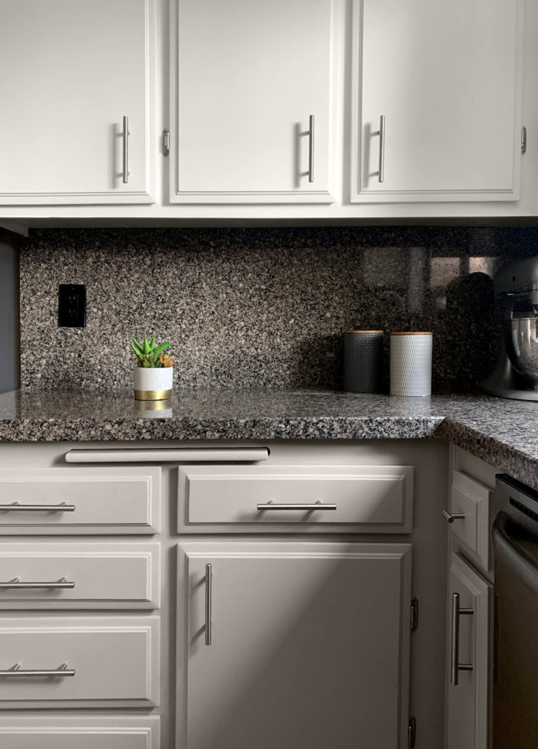 tight shot of kitchen cabinets showing some from the top and others from the bottom.
