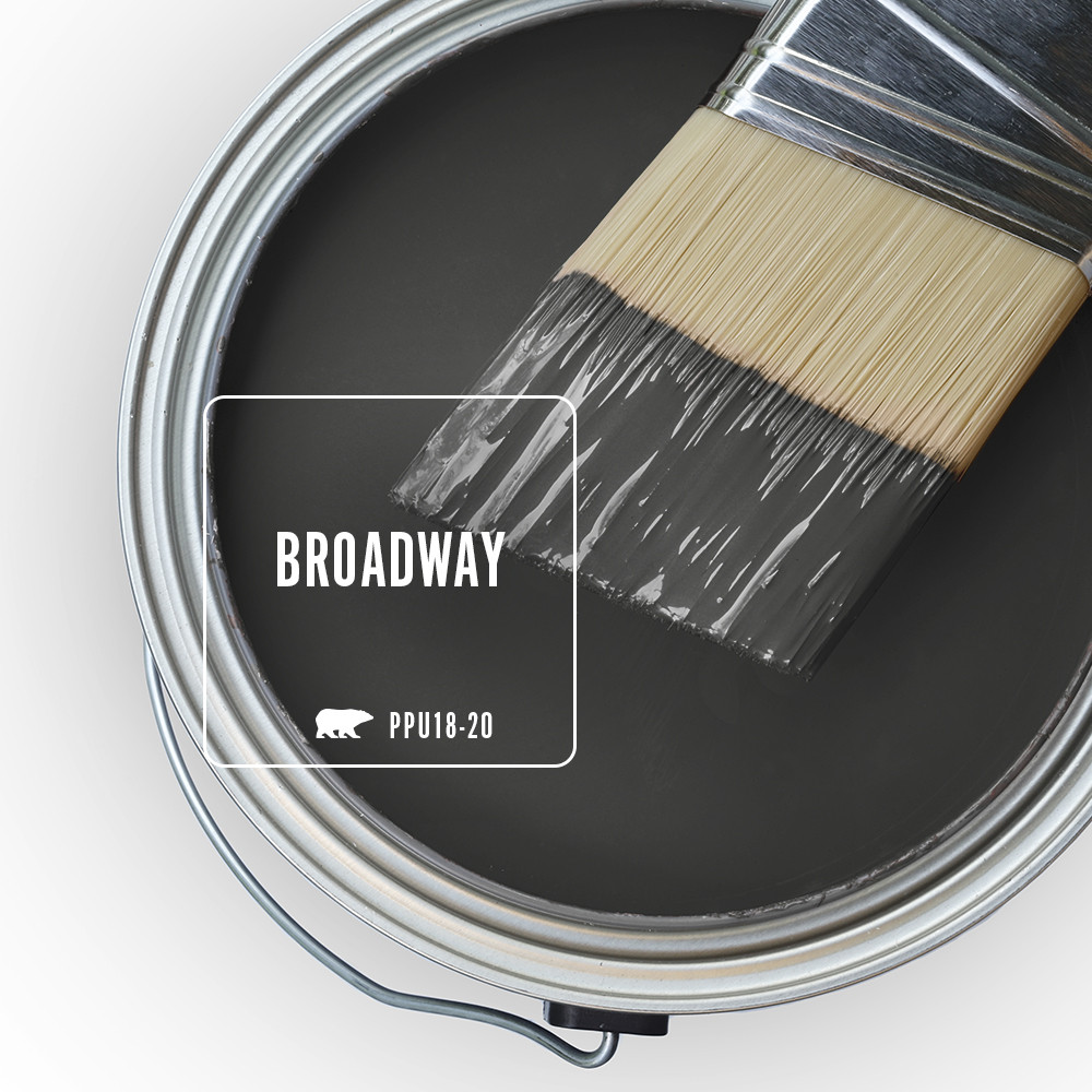 An open paint can top view featuring a black color called Broadway.