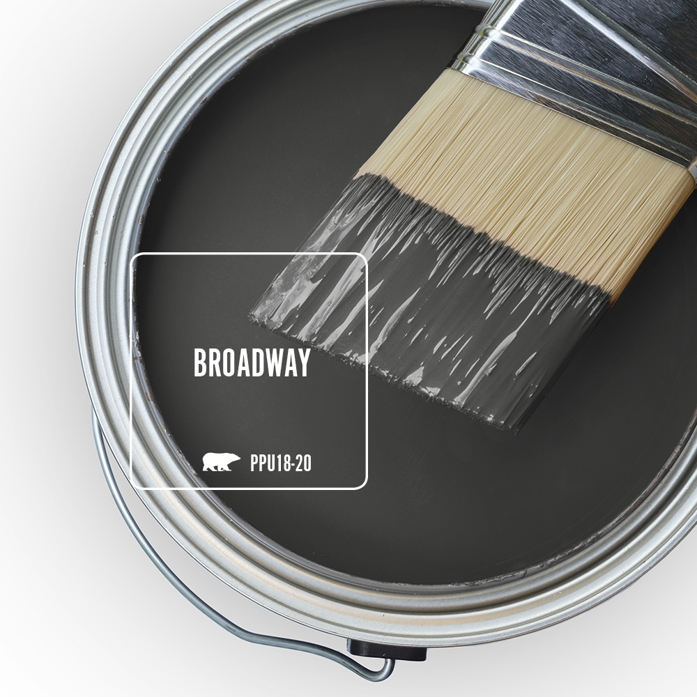 An open paint can showing the color Broadway (black) inside the can.