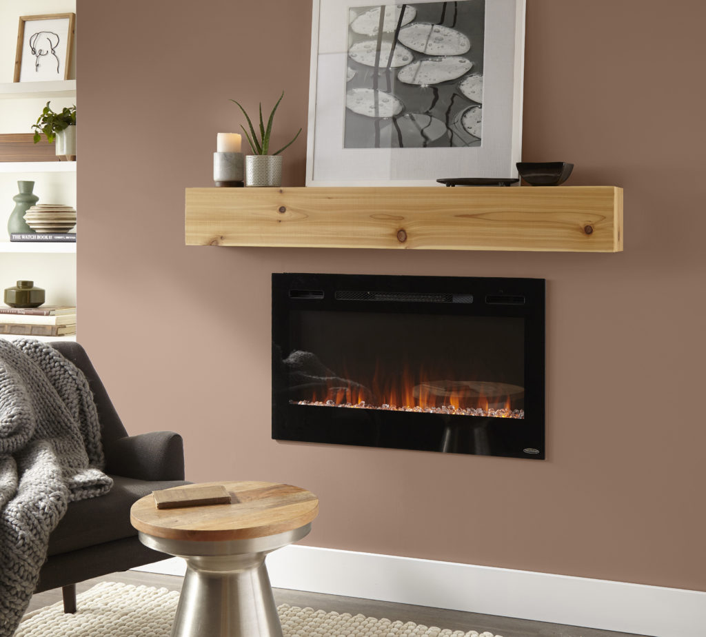 An accent wall featuring a modern fireplace with a simple natural wood mantle.  The wall is painted in a grounding and cozy color called Wild Mustang.