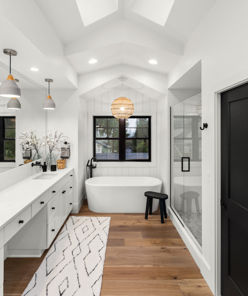 Master bathroom with double vanity, walls and cabinetry are all painted in a white color called Whisper White. 