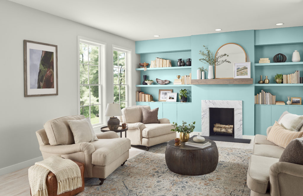 Living room centered around coastal look and feel. Accent shelving in Tahitian Sky. 