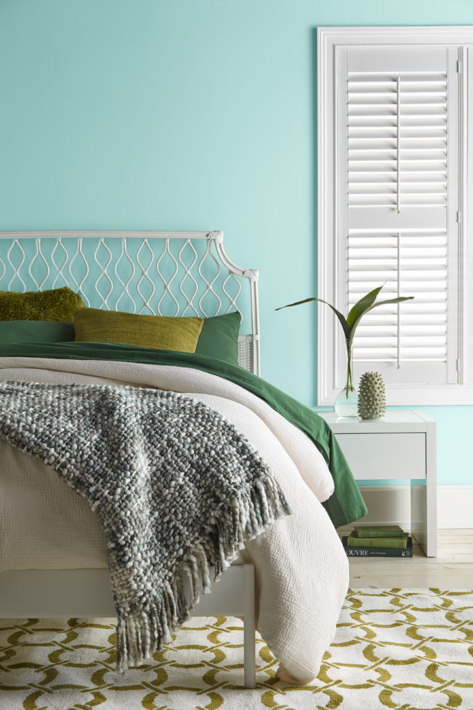 Bedroom image with a coastal vibe painted in Wave Top M450-3. 