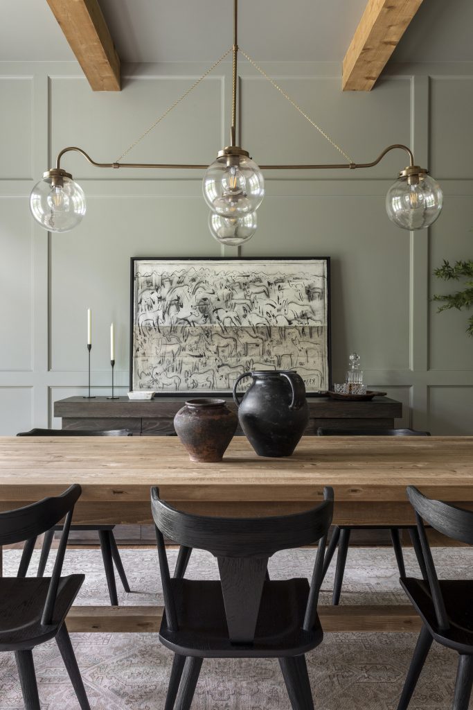 Lauren Lane's dining room painted in a warm gray with a warm green undertone.