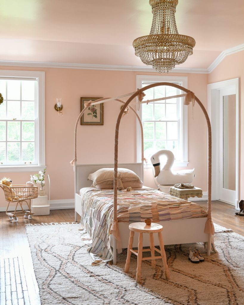 A girls rooms painted in pink for the walls and ceilings.