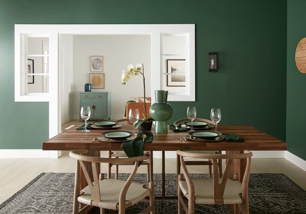 A casual dining room with a table setting ready for entertaining. 
