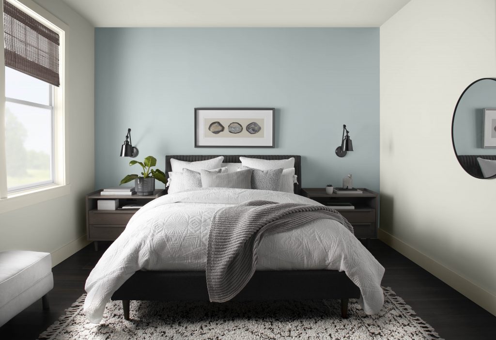 Bedroom image with Accent wall. Bed and two side tables 