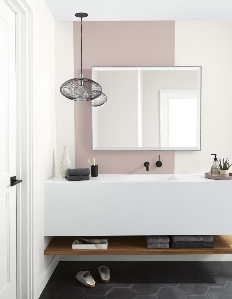 A modern bathroom with geometric design painted in a pink paint color called Smokey Pink. 