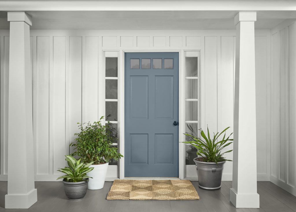 A traditional home's front door painted in Adirondack Blue - a popular blue color. 