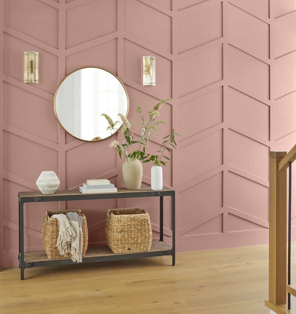 Entry area with textured walls painted in a mauve-pink hue.
