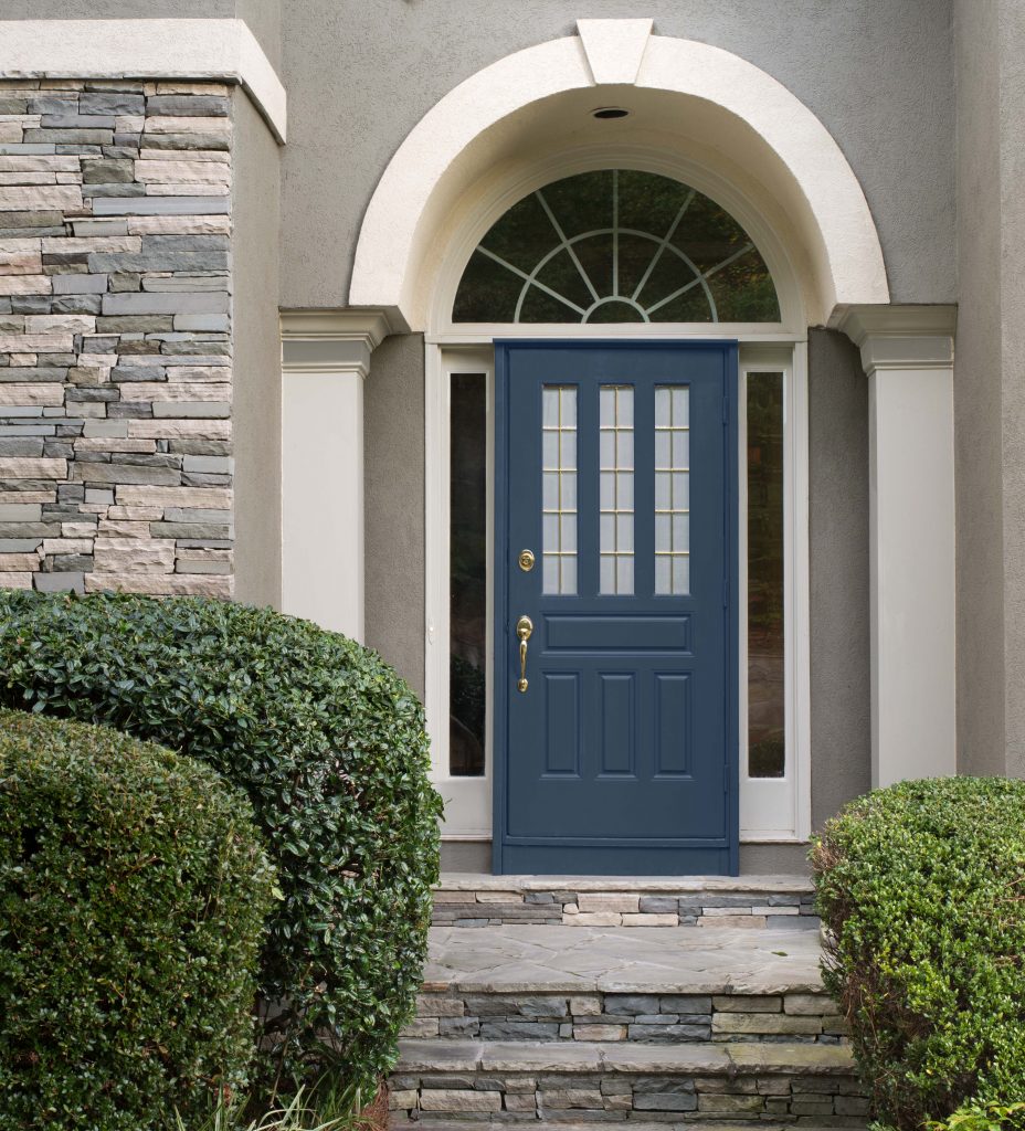 A home showing the front door painted in a navy blue hue.