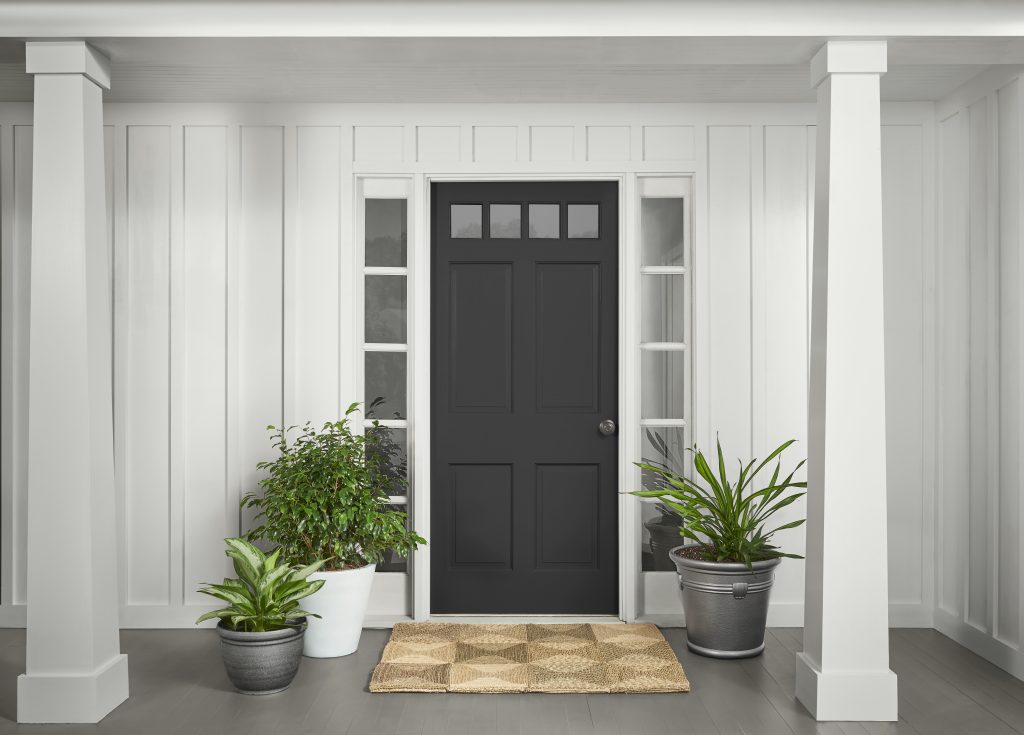 A home showing the front door painted in black.