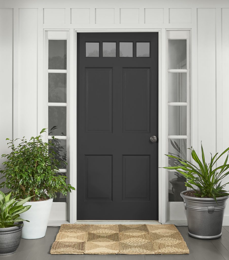 A home showing the front door painted in black.