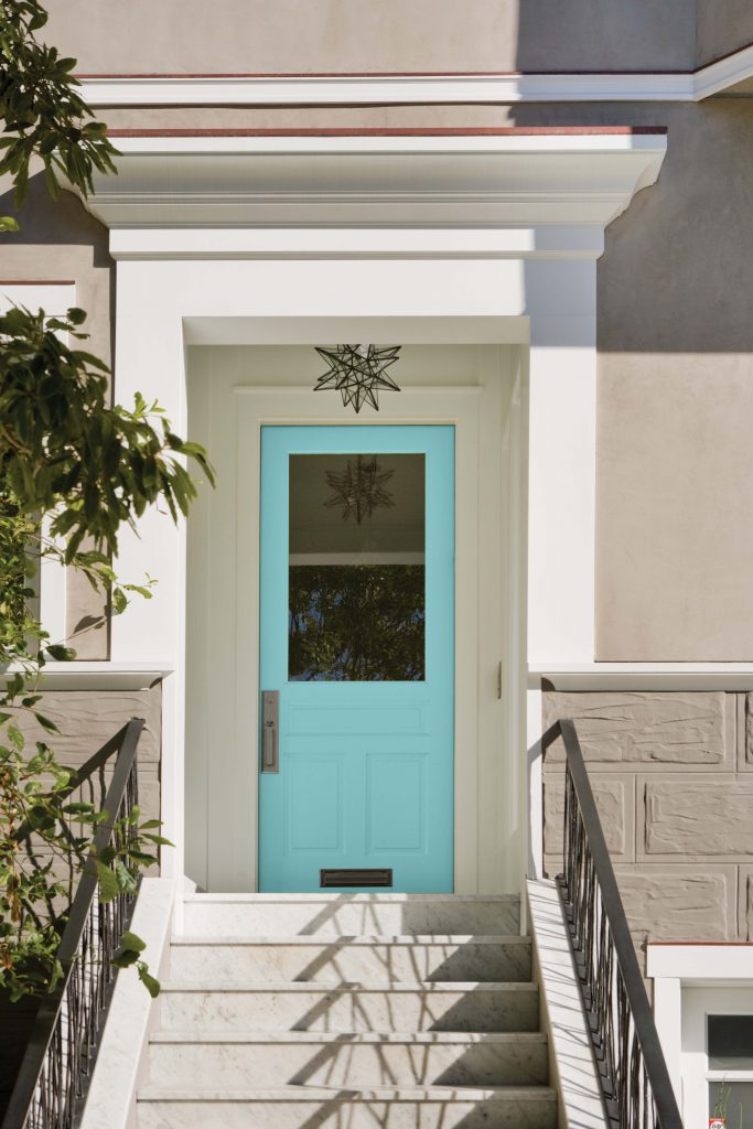 A home showing the front door painted in a blue hue.