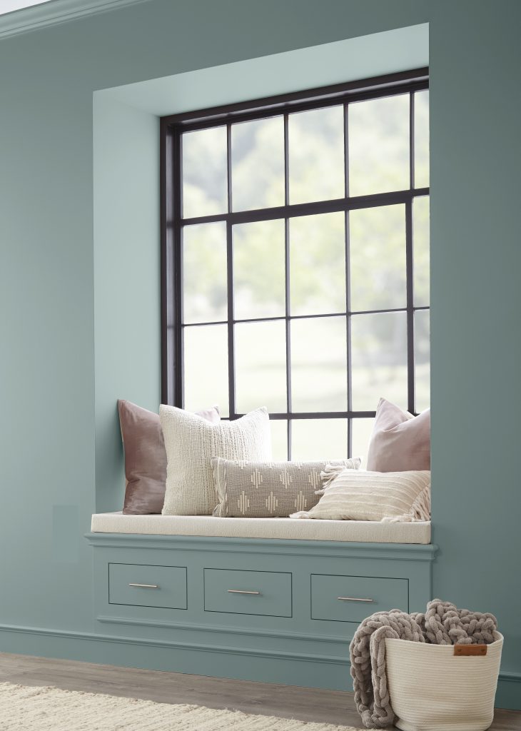 A reading nook area featuring a dusty soothing blue color called Provence Blue. 