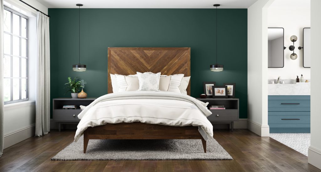 An Urban Farmhouse style master bedroom and bathroom combo.  The accent color on the headboard wall is a BEHR top selling deep green called Dark Everglade. 