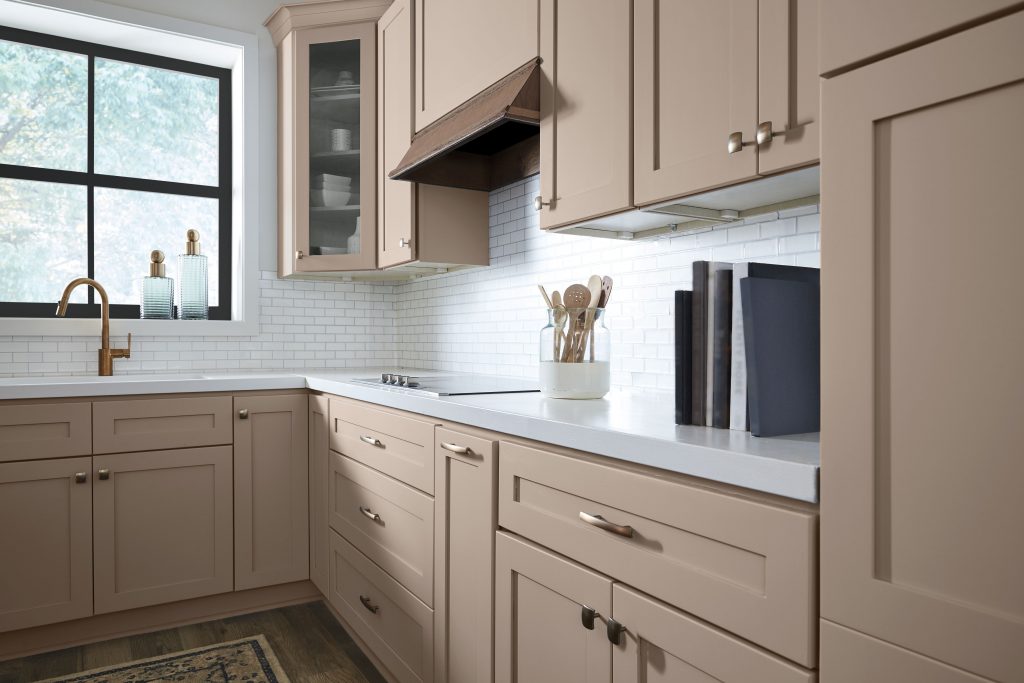 This kitchen features classic cabinetry in a rosy neutral called Chic Taupe.  A metallic finish on the hardware gives this kitchen a more elevated feel. 