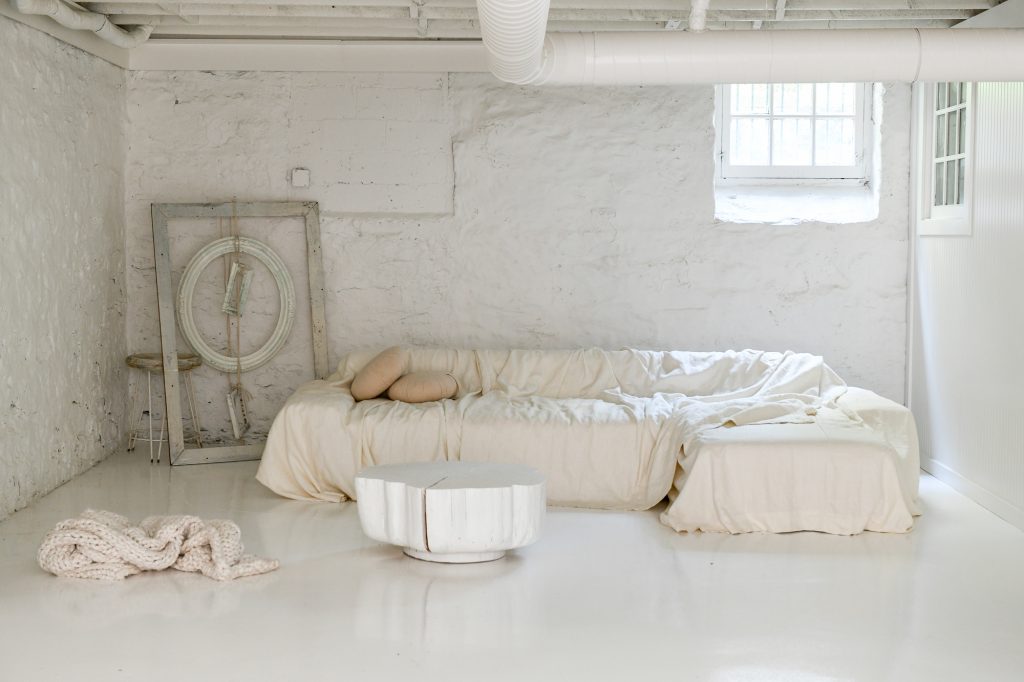 A comfy couch placed in the basement.