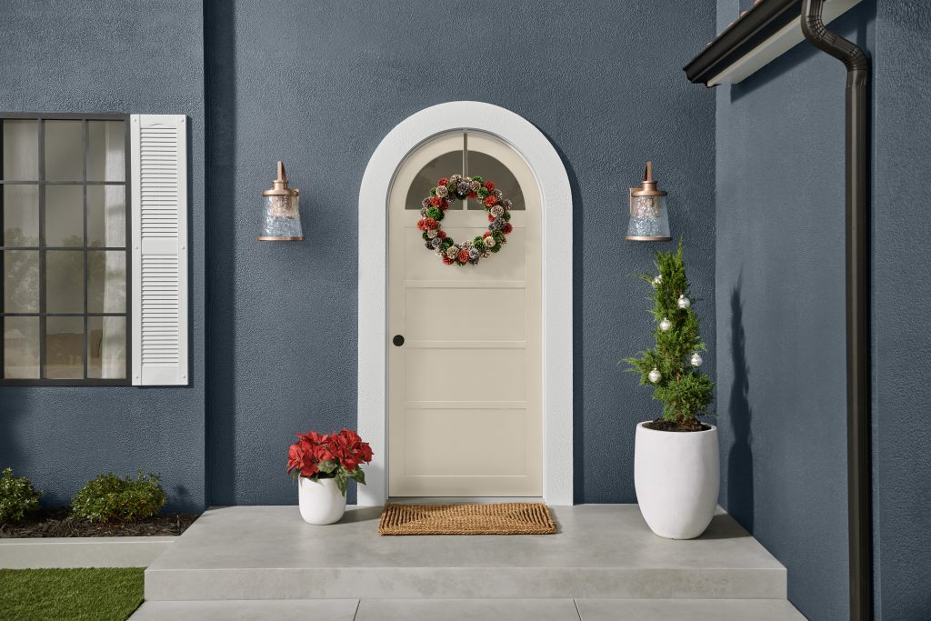 Exterior house image with pinecone wreath and holiday decor.