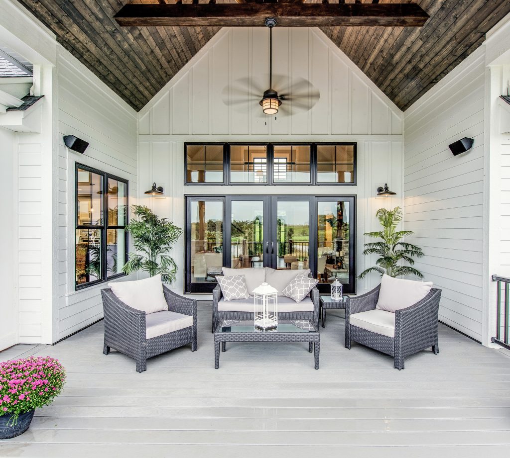 A modern farmhouse patio.  The color on the house body is Whipped Cream. 