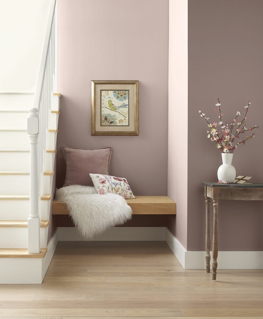 A small nook painted in a dusty pink hue.
