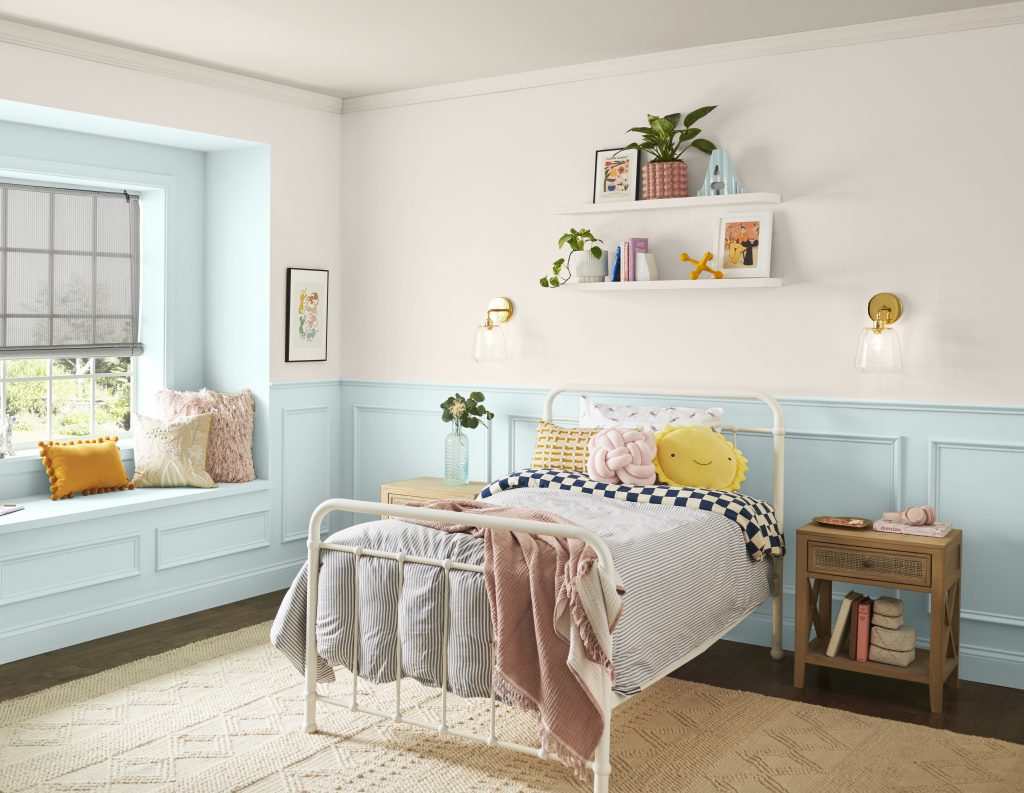A kids bedroom with and off-white color on the upper walls and a light blue color called Offshore Mist on the trim and molding. 