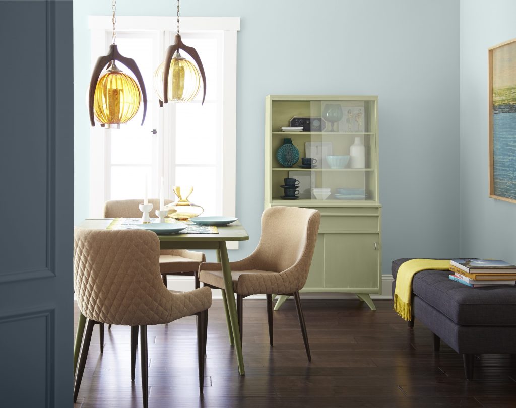 And retro eclectic dining area with Offshore Mist color on the walls and pop of color on the furniture and décor items.  