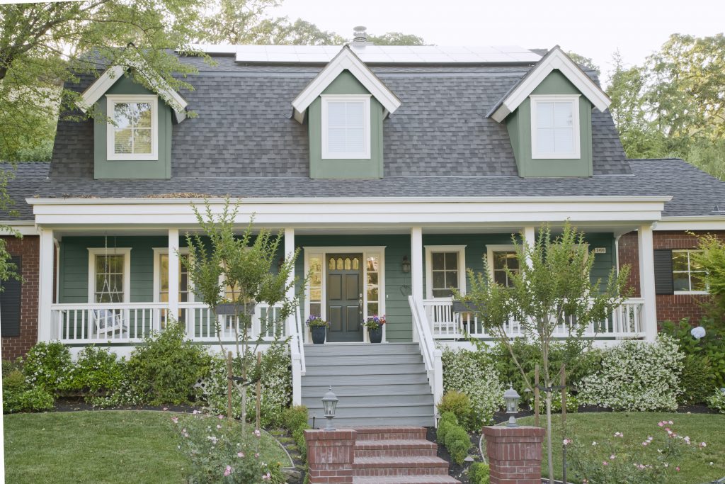 Exterior home painted in a duty green color.