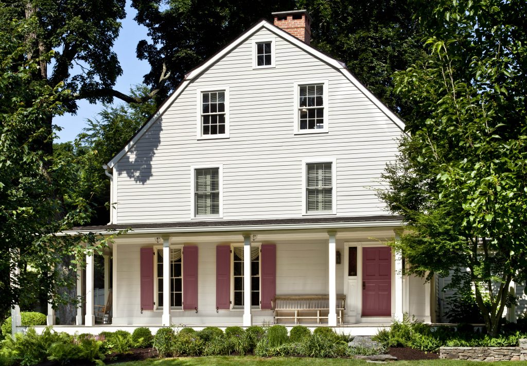 An exterior home painted in a grayed-white hue.