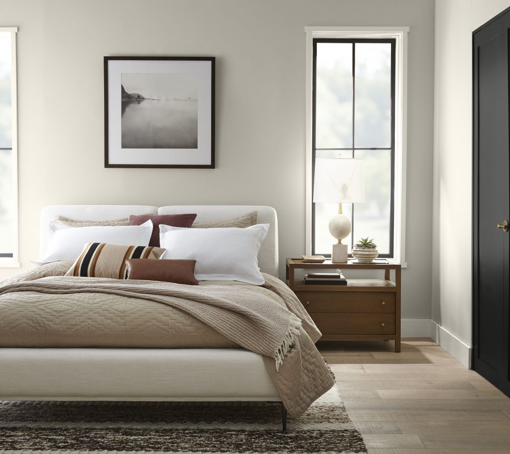 A bedroom painted in a soft white hue.