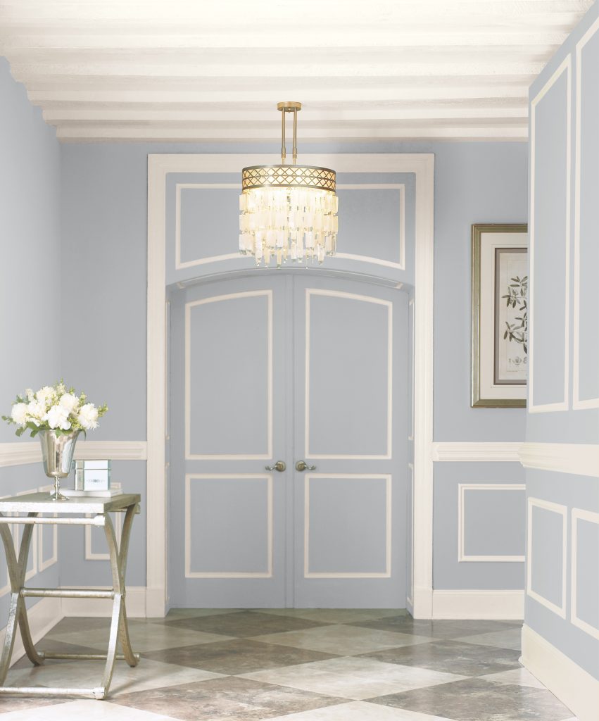 An entry with a quiet cool gray painted walls.
