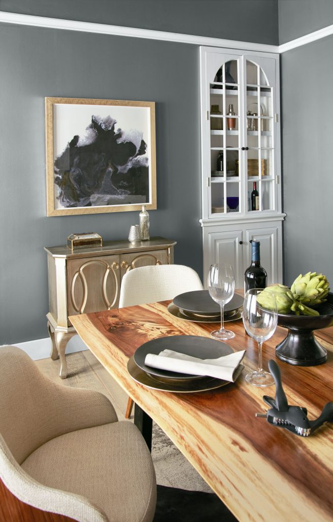A dining area with a cool silvery-blue hue painted on the walls.