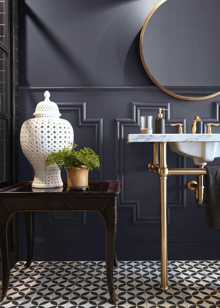 A bathroom painted in a dusted gray-black hue