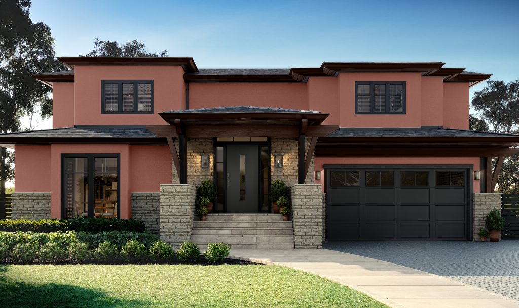 A contemporary two-story home painted in warm terracotta with dark trim and stone accents, creating a bold yet natural look.