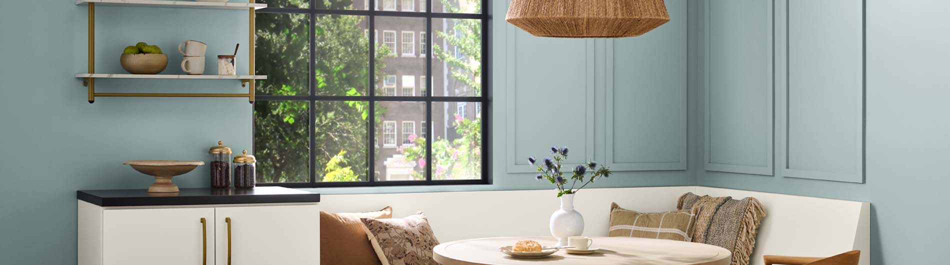 Living room with cozy couches and a fireplace. The wall is painted in the color Blank Canvas.