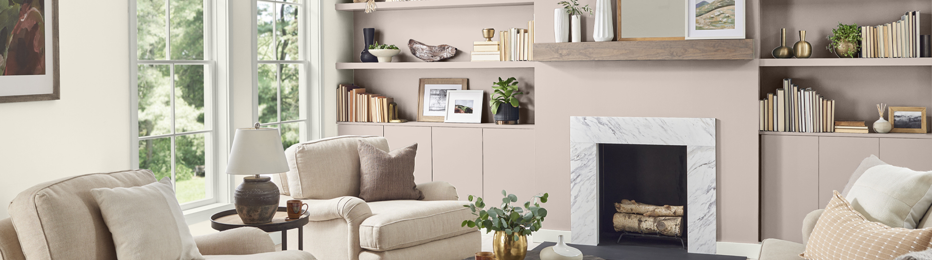 Living room with cozy couches and a fireplace. The wall is painted in the color Blank Canvas.