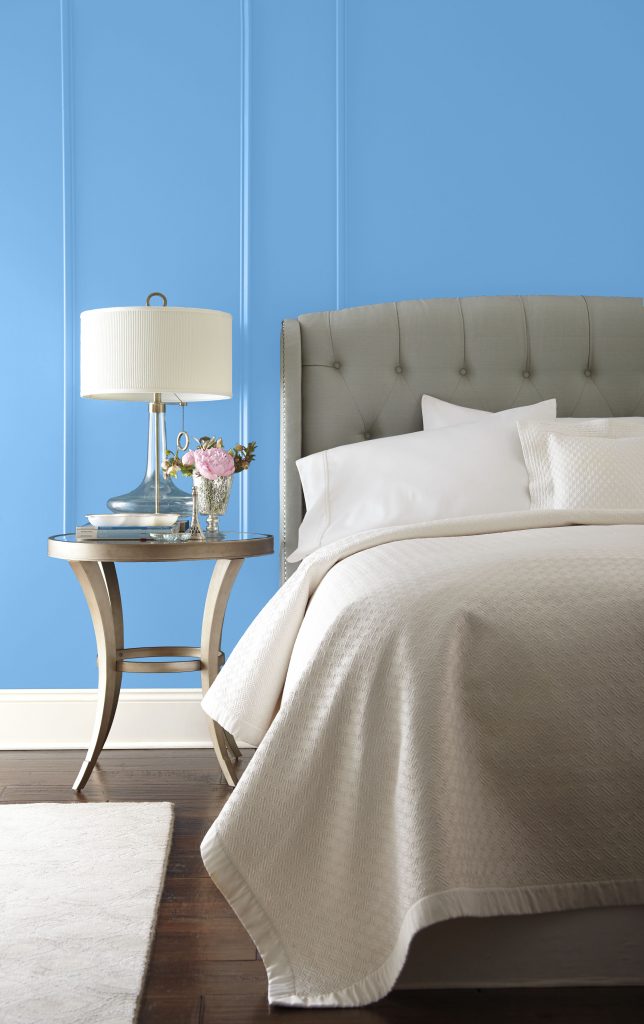 Bedroom finished in a cool, clear blue hue that feels calming and timeless, with furnishings playing a quiet supporting role.